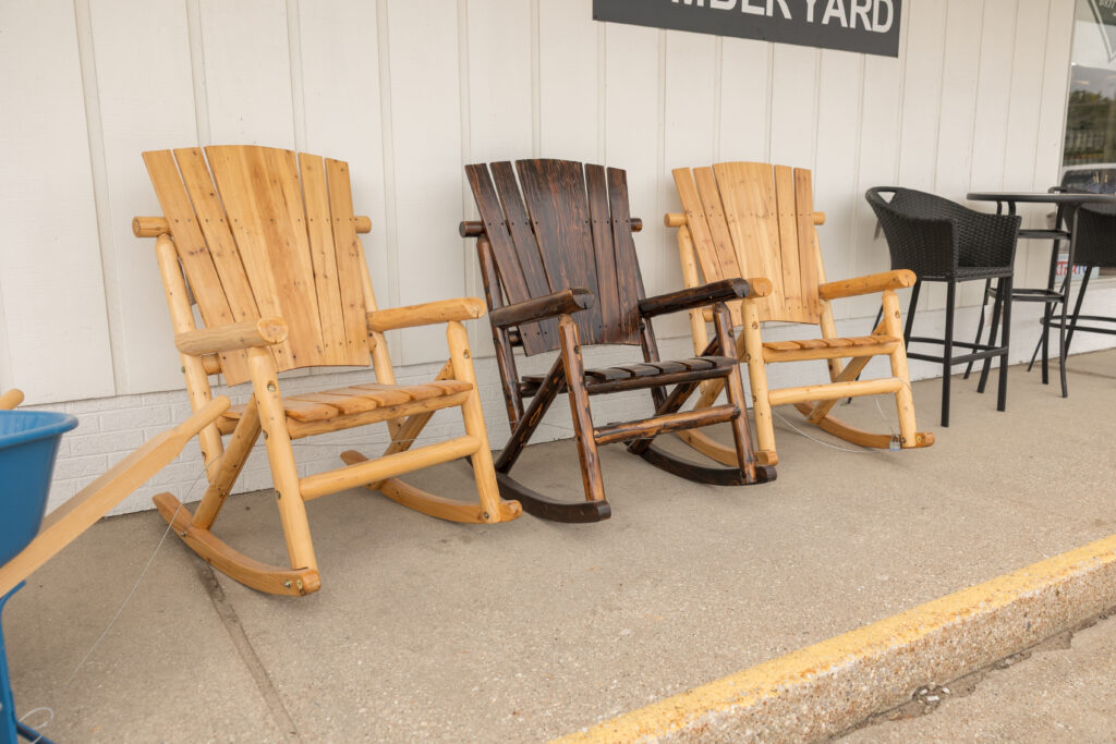 Three rocking chairs outside of store front